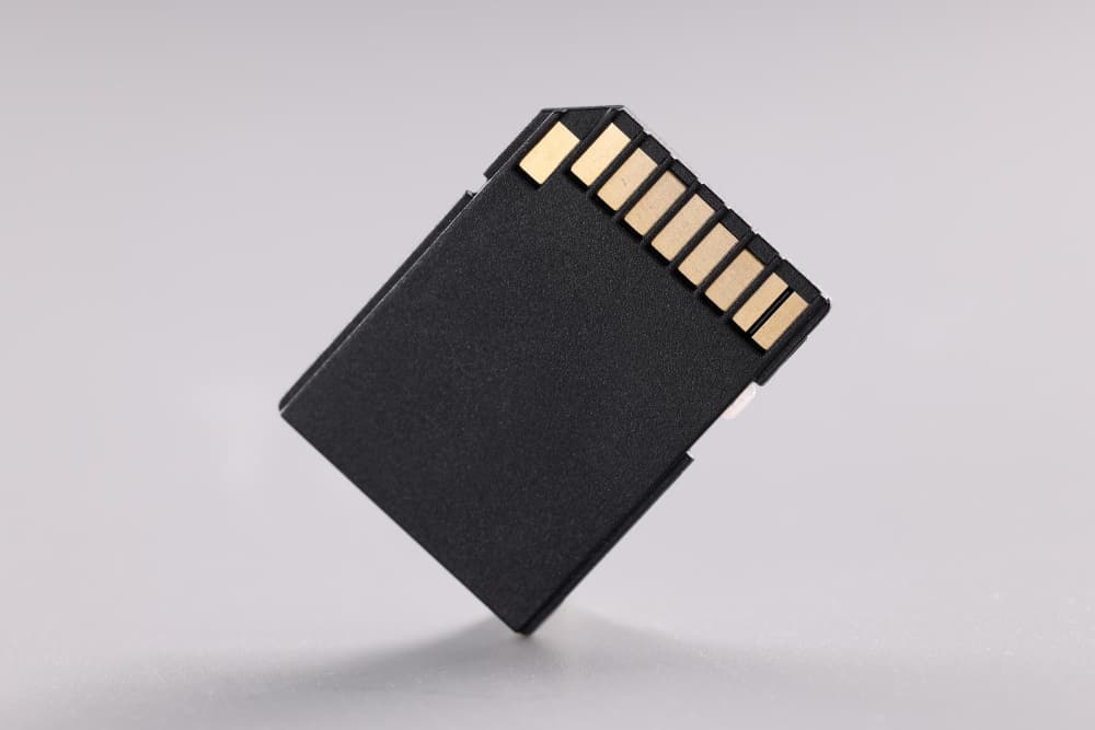 A memory card is upside down on a table.